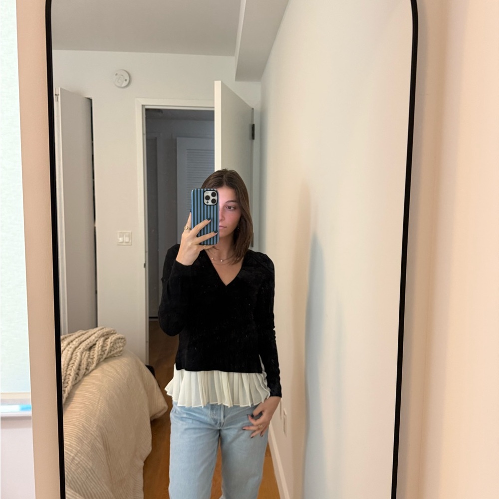 Black sweater with fabric on bottom